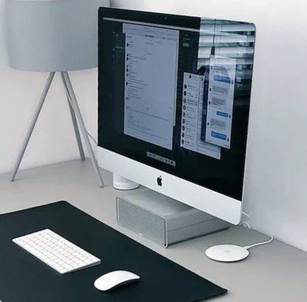 Minimalist desktop computer workspace representing modern NGO web design and web development for non-profit organisations.